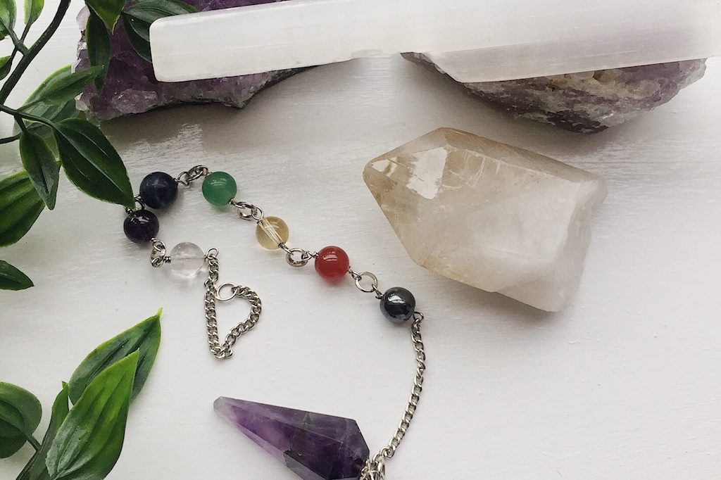 Crystals for healing. Pendulum, master quarts and selenite wand.